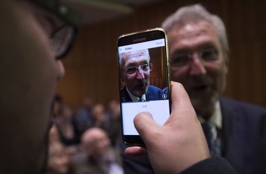B.C. NDP MLA Leonard Krog is recorded on a iPhone as a reporter interviews him as they wait for the municipal election results to com in in Nanaimo, following the municipal election Oct. 20, 2018.