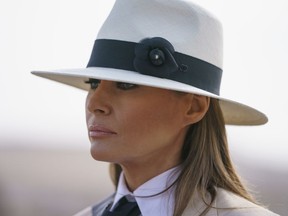 In this Oct. 6, 2018 photo, First lady Melania Trump pauses as she speaks to media during a visit to the historical Giza Pyramids site near Cairo, Egypt. First lady Melania Trump says she thinks she's among the most bullied people in the world and there are people in the White House she and President Donald Trump can't trust.