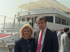 U.S. real estate developer Donald Trump and his wife, Ivana, pose with their new luxury yacht in 1988.