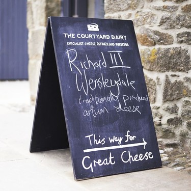 Sign outside The Courtyard Dairy in Settle.