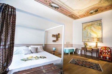 One of the rooms (with a travellers theme) at the SoprArno Suites, Florence.