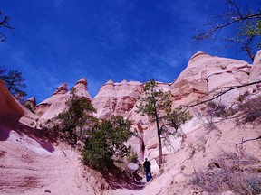 The oddly-shaped rocks and clear blue skies of New Mexico are a big attraction at Kasha-Katuwe Tent Rocks National Monument, west of Santa Fe.