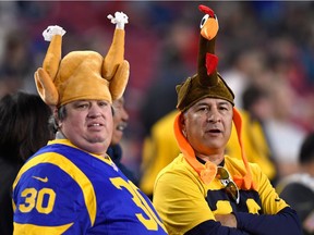 Football fans wear turkey hats in honour of U.S. Thanksgiving as they attend the game between the Kansas City Chiefs and the Los Angeles Rams at L.A. Memorial Coliseum on Nov. 19, 2018 in Los Angeles.