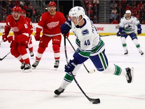 Elias Pettersson of the Vancouver Canucks scores on a shot in the first period against the Detroit Red Wings.