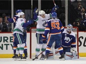 Jake Virtanen celebrates his eighth goal of the season Tuesday.