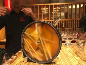 Cocktails being made in porthole infuser at The Four Peaks Cornucopia dinner at Four Seasons Hotel in Whistler.