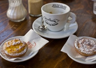 A traditional Tuscan breakfast at Le Nuvole (bar-meets-tabacchi-meets-café ) the first stop on the Other Side of Florence Tour. This is a macchiatone coffee served with budino di riso (rice pudding).