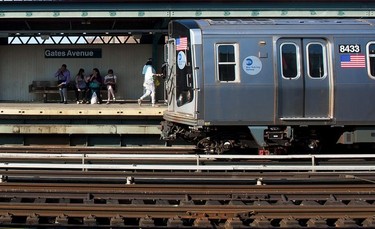 Waiting for the train at Gates Avenue Station.