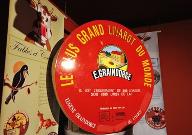A replica of the world's largest livarot cheese inside the Graindorge cheese fabriqué in Livarot. It measured around one metre in diameter and was made from 1165 litres of milk (the equivalent of 250 standard size livarot cheeses).