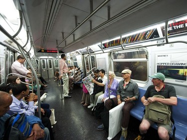 Visitors and locals inside a New York train.