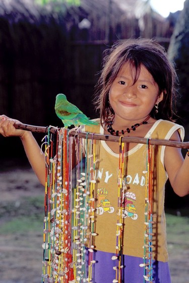 Kuna Indian child selling shell necklaces.