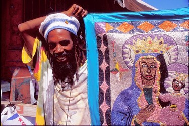 Displaying the voodoo flag of Erzulie Bantor, the Black madonna.