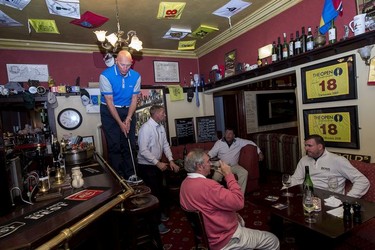 Golfing guests play the 'Duck of Fame' golf game inside the Duck's Inn, Aberlady.