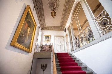 A staircase leads to the Ad Astra, Florence.