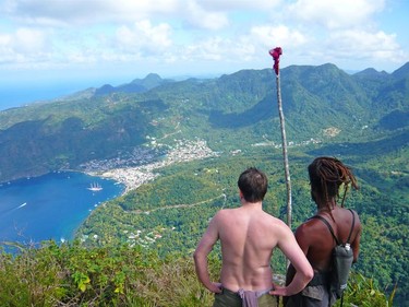 One time use  only. ST LUCIA.  A walker and his guide takes in the magnificent views from the summit of Petit Piton.  caribbean2.0  Caribbean Travel2.0 Photo credit: Andrew Marshall [PNG Merlin Archive]