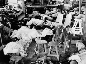 (FILES) In this file photo taken on November 19, 1978 bodies of more than 400 members of the Jim Jones' sect "Temple of people" lie down, in Jonestown, where the Cult leader Jim Jones had established the Peoples Temple.