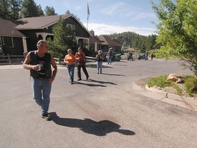 In this Aug. 6, 2006 file photo, a group of bikers survey the scene of a biker gang related shooting Wednesday morning, Aug. 9, 2006 outside the Legion Lake Resort near Custer, S.D.