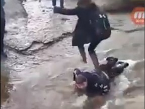 A shocking video posted to Facebook shows a 14-year-old Brett Corbett, lying face down in a rushing stream as another teen jumps onto him and then leapfrogs to the other side of the water to avoid getting wet. Around him are other students from Nova Scotia's Glace Bay High School -- watching, laughing, recording -- and one takes the opportunity to throw a rock at him.