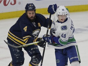 Zach Bogosian keeps Elias Pettersson in check during sleepy Saturday matinee in Buffalo.