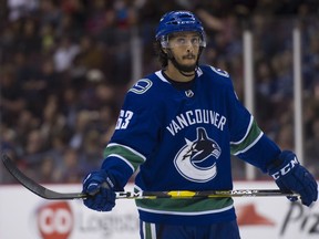 Jalen Chatfield during a break in play against the Calgary Flames in the first period of a preseason NHL hockey game at Rogers Arena, Sept. 19.