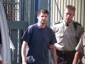 Accused child abductor Randall Hopley is led out of the Cranbrook, B.C. courthouse on Wednesday Sept. 14, 2011. The father of a boy who was abducted from a home in southeastern British Columbia says his family wasn't notified about the release of the high-risk offender.