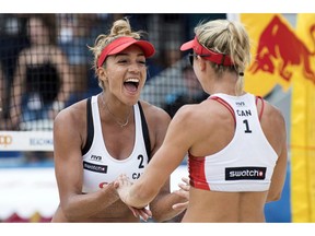Brandie Wilkerson of Canada, left, and her teammate Heather Bansley of Canada celebrate during a women's quarter final game at the Beachvolley Worldtour Major Series, on Saturday, July 14, 2018 in Gstaad, Switzerland. The Canadian duo of Heather Bansley and Brandie Wilkerson have enjoyed a breakthrough season on the FIVB Beach Volleyball World Tour.