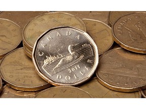 Canadian dollars are pictured in Vancouver, Sept. 22, 2011.