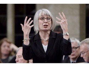 Labour Minister Patty Hajdu says the federal Liberals have given the House of Commons notice that it is prepared to order an end to rotating strikes by Canada Post employees through legislation. Hajdu rises during question period in the House of Commons on Parliament Hill in Ottawa on Tuesday, Oct. 23, 2018.