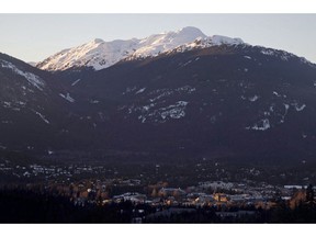 The village of Whistler, B.C. is seen as the sun sets on the snow capped mountains Friday, Feb. 3, 2012. Demand from retirees, investors and those looking for a winter getaway, is driving strong demand for condominiums in popular recreational real estate markets, at times, nearly double the rate for detached homes, says a report by Royal LePage.