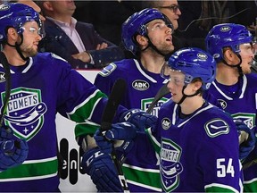 Utica Comets winger Jonathan Dahlen celebrates with teammates after scoring a goal against the Laval Rocket in a 3-1 win on Friday in Utica.