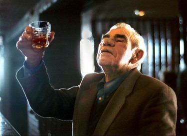 A local enjoys a whiskey in a Dublin pub.