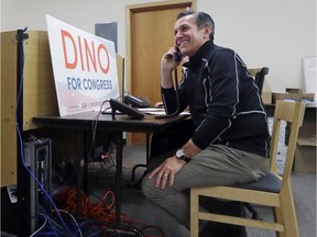 Republican Dino Rossi who is running for the 8th Congressional District, works the phone lines with staff and volunteers calling potential voters on Monday in Issaquah, Wash. The hotly contested open seat has been one of the costliest in the nation as Democrats see a potential pickup that could help determine control of the U.S. House.