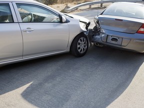 Two cars in collision on roadway.