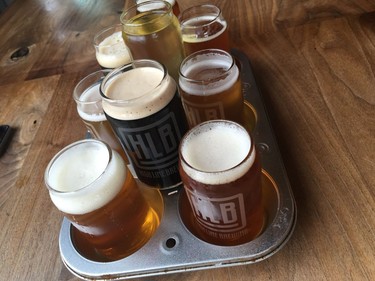 The team at Calgary's High Line Brewing uses muffin tins to serve their flights of beer.
