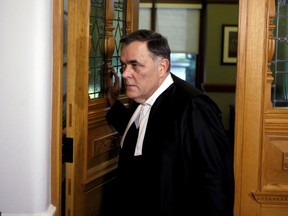 House Speaker Darryl Plecas leaves his office as journalists try to ask him questions outside his office at Legislature in Victoria, B.C., on Thursday, November 22, 2018.
