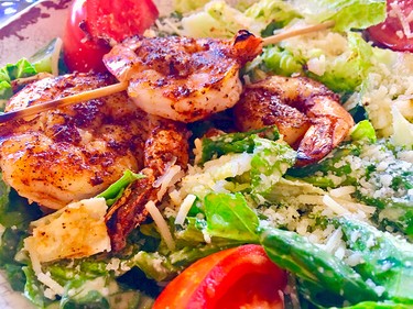 Blackened shrimp on a Caesar salad at the Snook Inn on Marco Island are a delectable combination.
