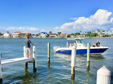 The Snook Inn on Marco Island affords diners spectacular water views of passing watercraft, some of which dock at piers adjacent to the restaurant.