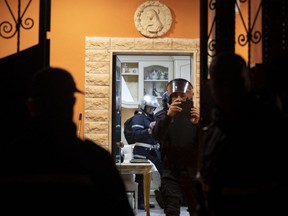 Police enters one of eight illegally built villas belonging to members of the Casamonica criminal clan, in Rome, Tuesday, Nov. 20, 2018.