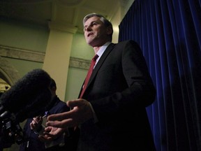 B.C. Liberal Leader Andrew Wilkinson answers questions from the media following the speech from the throne in the legislative assembly in Victoria, B.C., on February 13, 2018.