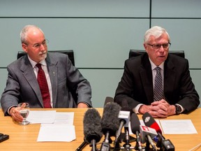 Sergeant-at-Arms Gary Lenz (L) and Clerk of the Legislative Assembly Craig James make a statement to media in Vancouver, B.C., on Monday November 26, 2018.