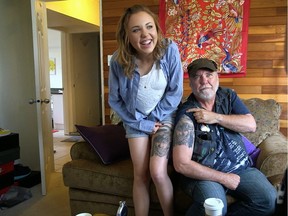 A sober Richard Lett and his 23-year-old daughter Breanna show off their matching tattoos.