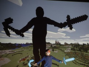 Hokuto MacDuff with swords in MINE, a new play about parenting and Minecraft.