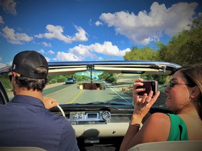 Cooper King and Natalie Murphy of the Andaz Scottsdale Resort and Spa take guests for a spin around town in Nora, a 1962 Cadillac.