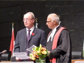 Surrey Mayor Doug McCallum takes the oath of office, with B.C. Provincial Court Judge Gurmail Gill, and his inauguration.