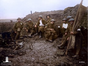 A colourized version of Canadian soldiers, some wounded, taking cover behind a pill-box at the Battle of Passchendaele. November, 1917.