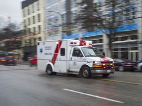 An ambulance races down E. Hastings Street in Vancouver, BC Wednesday, January 31, 2018.