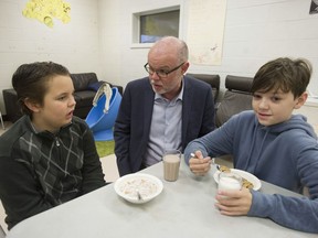 The Vancouver Sun and The Province Editor-in-Chief Harold Munro speaks to James Ardiel Elementary school Grade 6 students Roan O'Keefe (left) and Caleb Grant, during a meeting of the Surrey school's Breakfast Club.