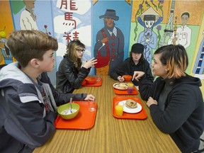 Britannia Secondary school students (clockwise from left to right) Liam Stone, Grey Talan, Kaelin O'Sidhe and Arianna Talan, eating breakfast at the school's Breakfast Club on Thursday, November 22, 2018.