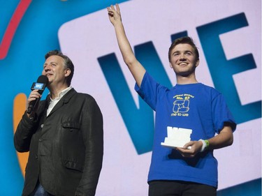 Vancouver mayor Kennedy Stewart (left) on stage at WE Day in Vancouver, Nov. 22, 2018.