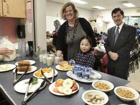 School principal Diana Ellis (left), student Jamilla Li, and one of Adopt-A-School's biggest donors Jack Kowarsky, who has given $275,000 in the last four years to feed hungry kids, at Bridgeview Elementary School in Surrey.